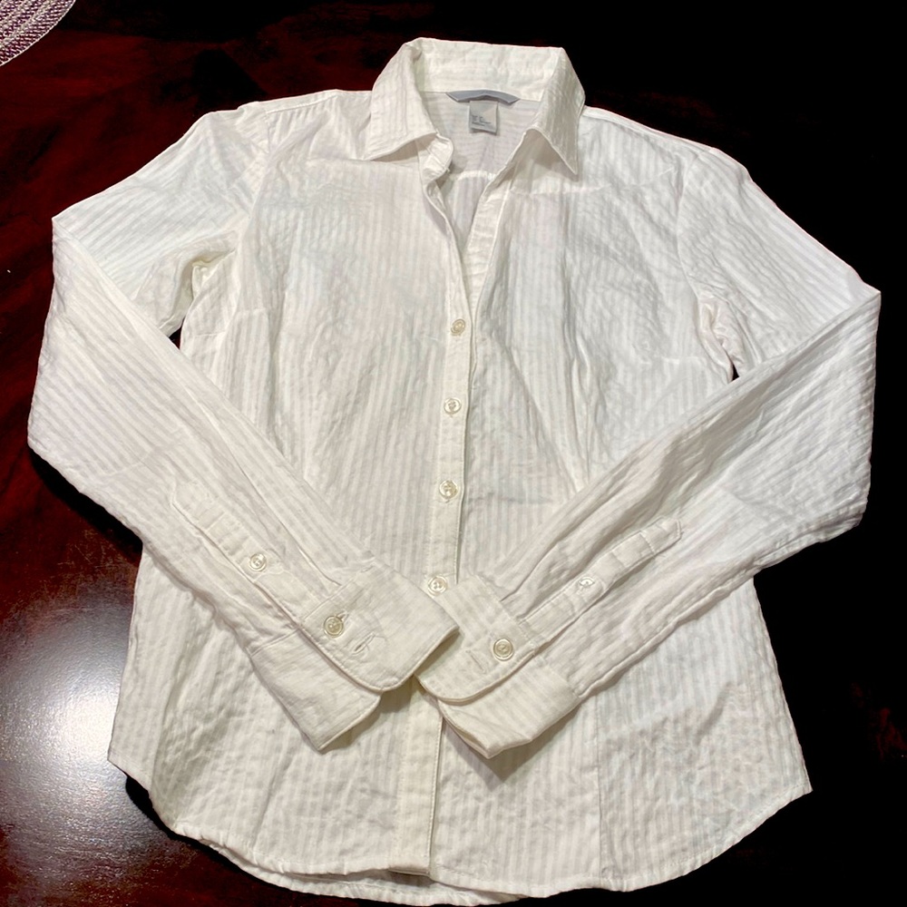 White fitted shirt.